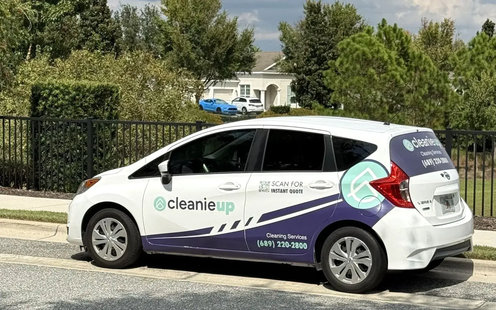 CleanieUp branded car parked on a residential street, on its way to a house cleaning in Winter Garden, FL