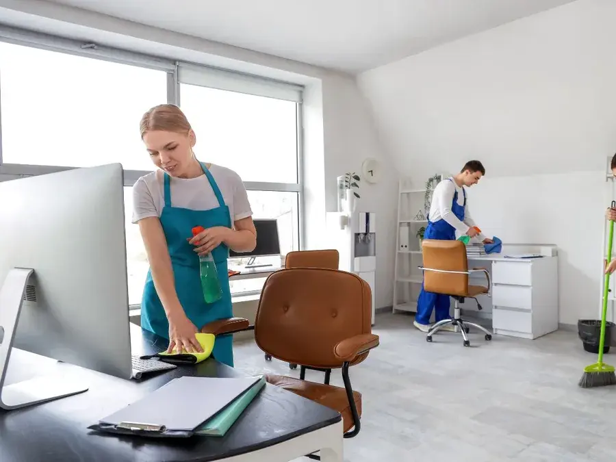 Cleaners wiping desks and sweeping floors in an office in Winter Garden, FL