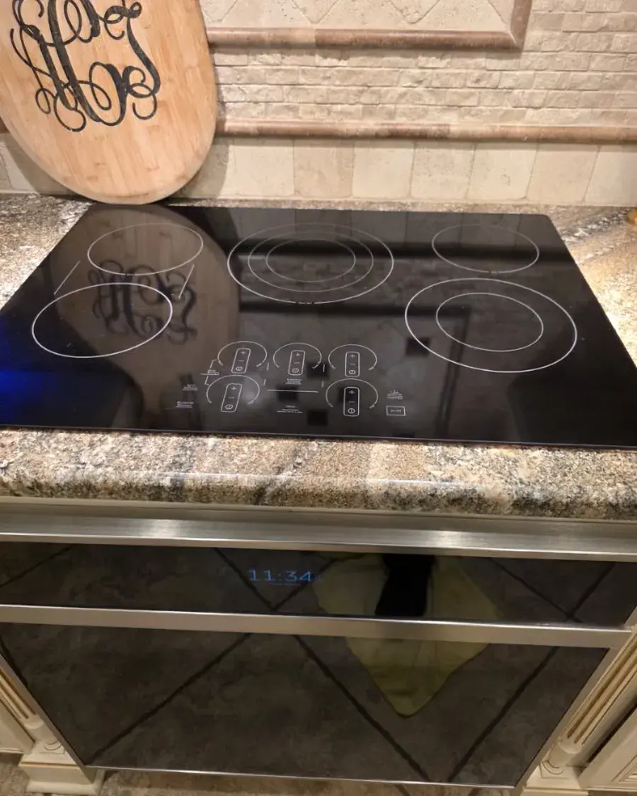 Glass cooktop wiped clean down to the controls during a deep cleaning in Ferndale, FL
