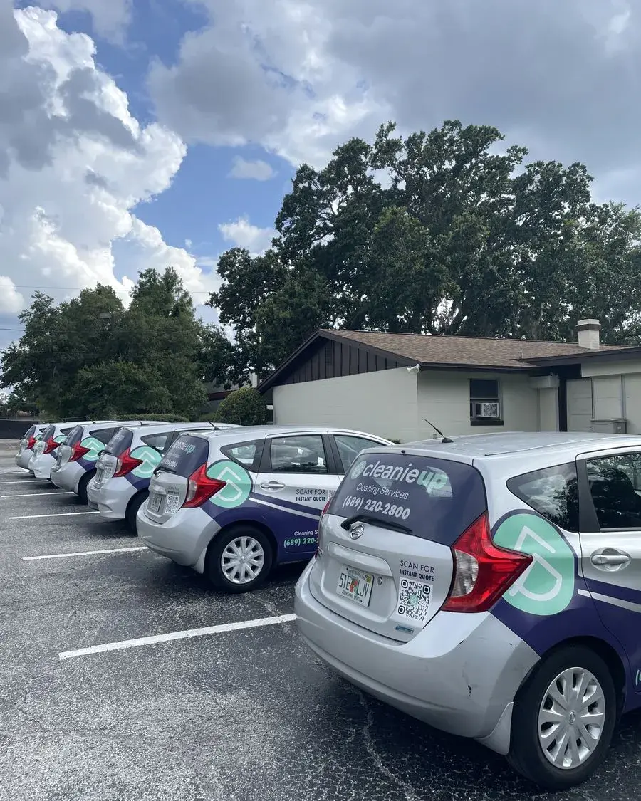 Row of CleanieUp cars in a parking lot before a commercial cleaning in Montverde, FL