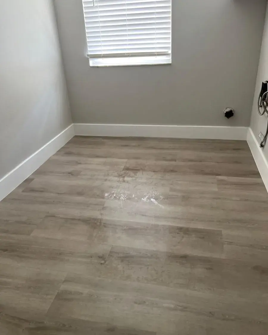 Empty room with clean vinyl plank floors after a move-out cleaning in Montverde, FL