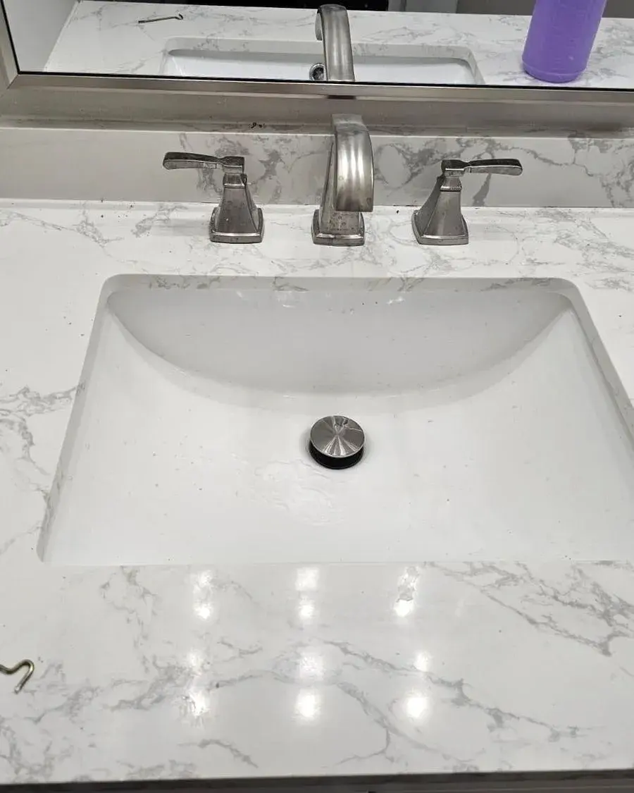 Marble-look vanity with a spotless undermount sink after a weekly house cleaning in Ocoee, FL