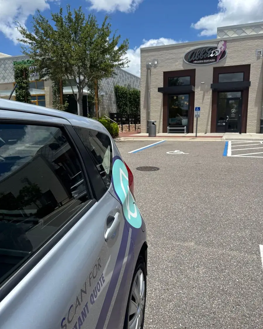 CleanieUp car parked outside a storefront for a commercial cleaning in Windermere, FL