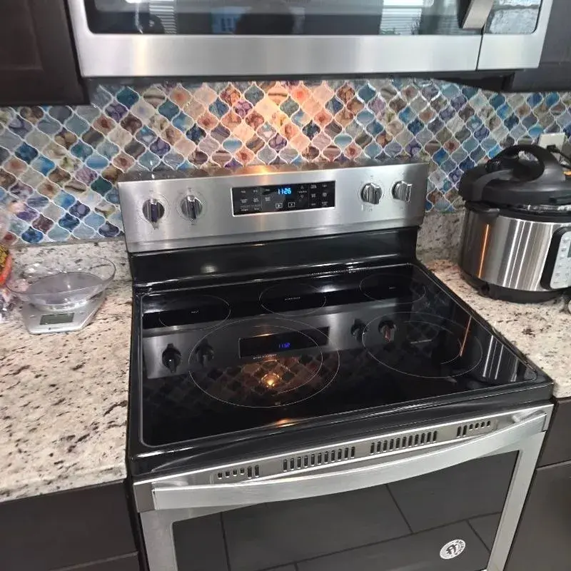 Polished stovetop and range after a CleanieUp deep cleaning in Winter Garden, FL