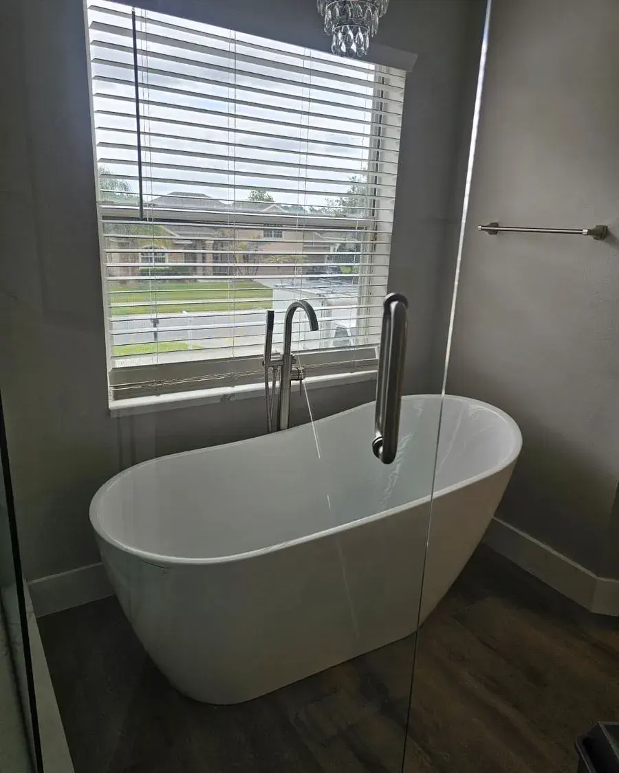Freshly cleaned bathroom with a freestanding tub in an empty home after a move-in cleaning in Winter Garden, FL