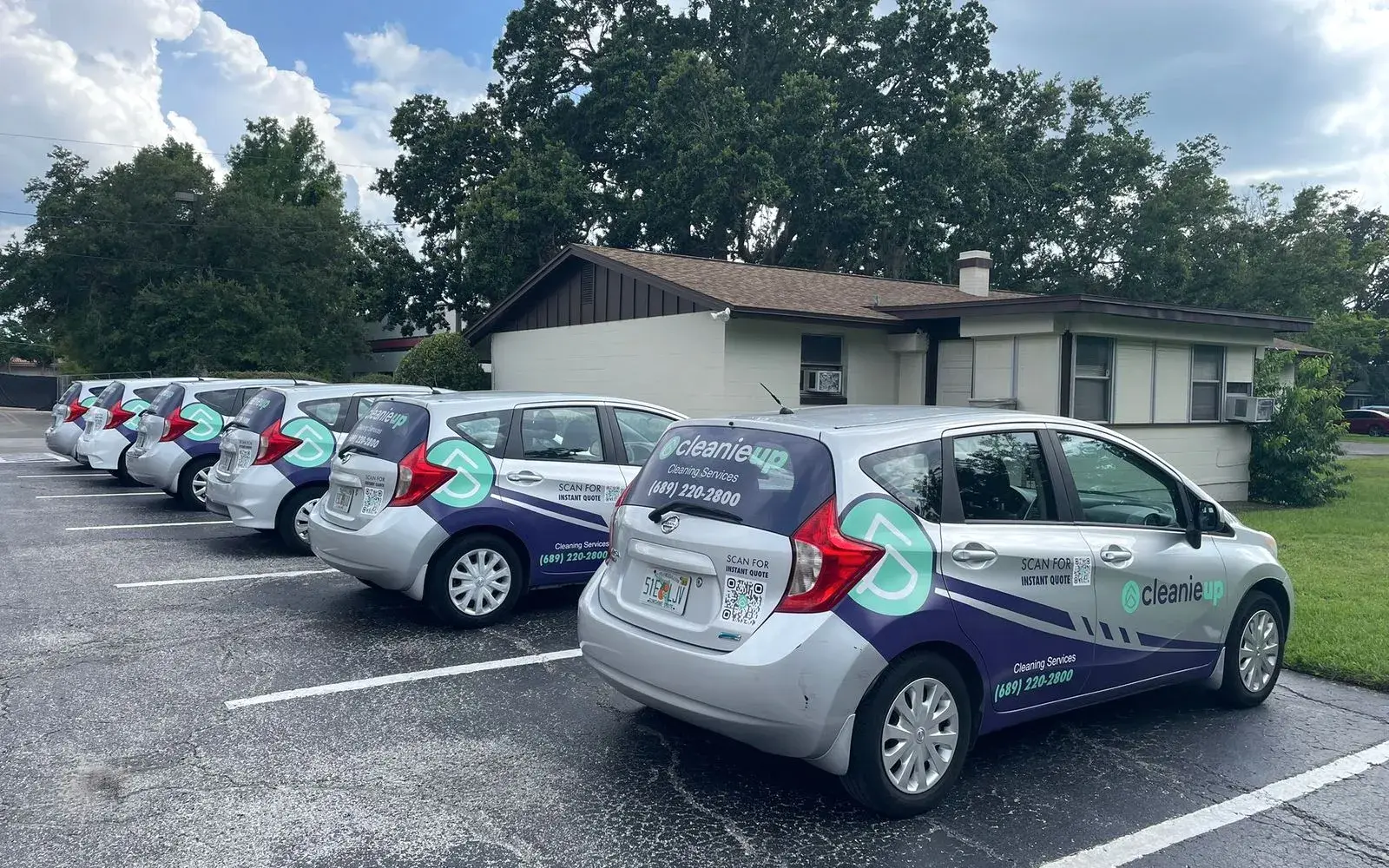 Row of branded CleanieUp cleaning cars ready for the day in Winter Garden, FL Row of branded CleanieUp cleaning cars ready for the day in Winter Garden, FL