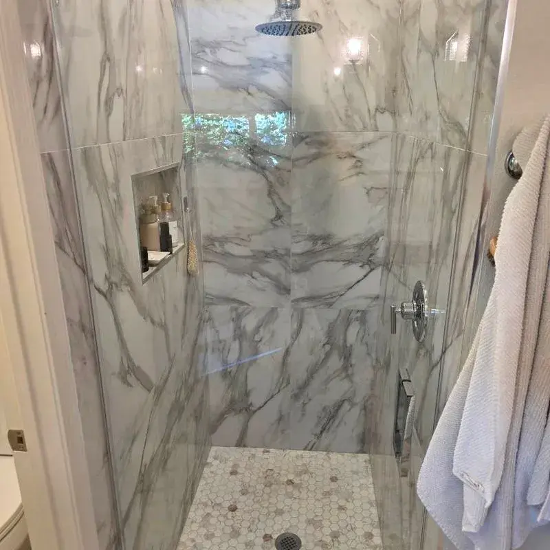 Marble walk-in shower after a CleanieUp deep cleaning in Winter Garden, FL Marble walk-in shower after a CleanieUp deep cleaning in Winter Garden, FL