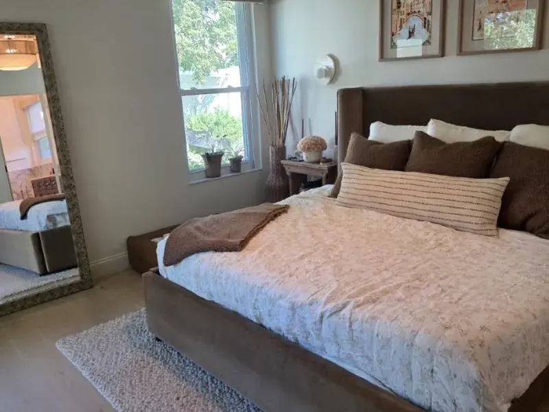 Bright bedroom with a neatly made bed after a biweekly cleaning in Winter Garden, FL Bright bedroom with a neatly made bed after a biweekly cleaning in Winter Garden, FL